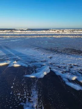 Waves and foam on the coast of the Atlantic Ocean Argentina Stock Photos