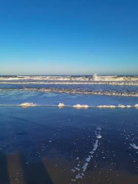 Waves and foam on the coast of the Atlantic Ocean Argentina Stock Photos