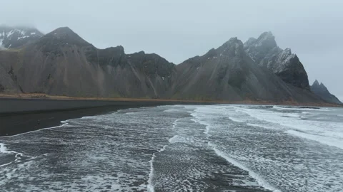 Waves and a Great Mountain backdrop 4K 50FPS Stock Footage 218265972