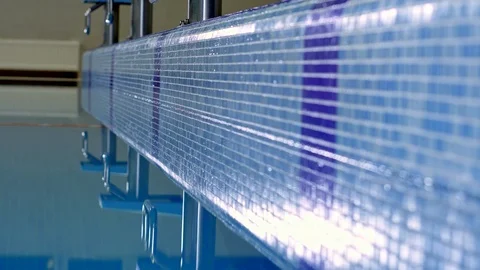 Waves and highlights on the water in the pool Stock Footage 99229386