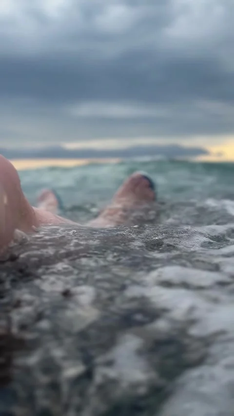 Waves and legs Stock Footage 249338597