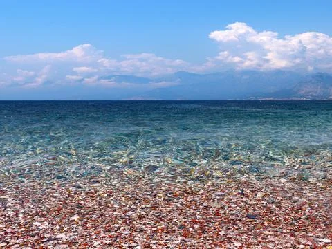 Waves and a pebble beach Фото