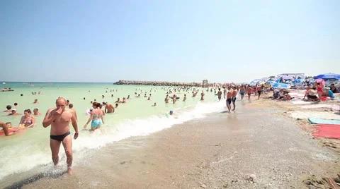 Waves and People at the Beach Stock Footage 65372641