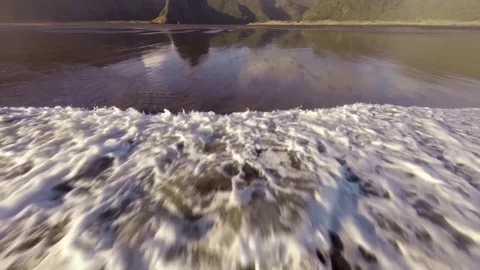 Waves And Reflection on Black Sand Stock Footage 76893679
