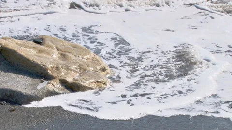 Waves and Rock close with audio Stock Footage 7907037