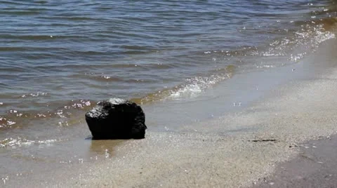 Waves and rock close up Video stock 11850000