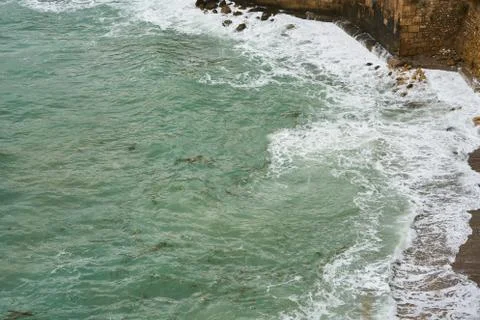 Waves and Rocks Background Stock Photos