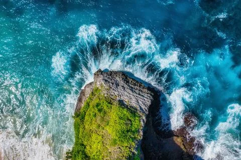Waves and rocks as a background from top view. Blue water background from t.. Stock Photos