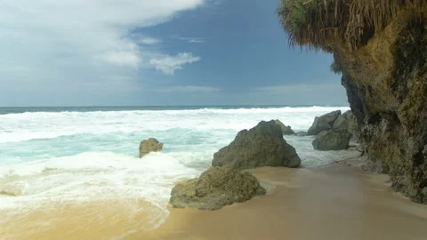 Waves and rocks on beach in Bali, Indonesia. Timelapse 4K Stock Footage 172432019