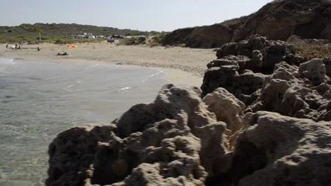 The waves and the rocks on the beach Stock Footage 117073380