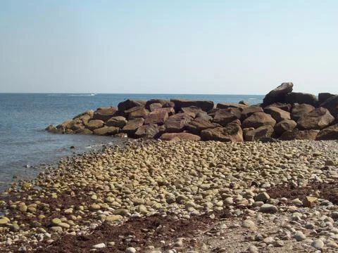 Waves and rocks at beach Stock Photos