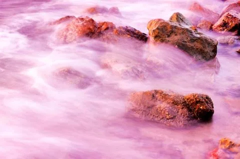 Waves and rocks Stock Photos