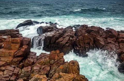 Waves and rocks Stock Photos