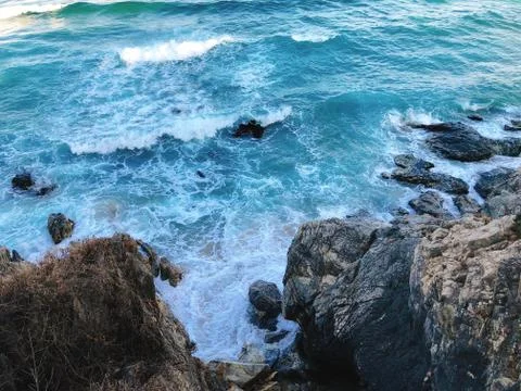 Waves and rocks Stock Photos