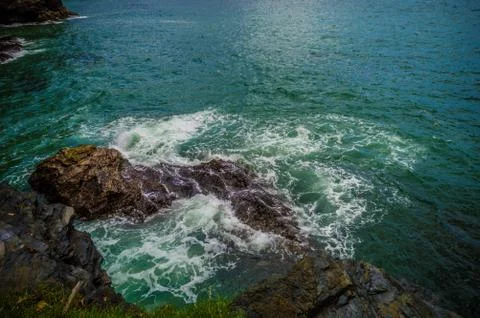 Waves and rocks Stock Photos