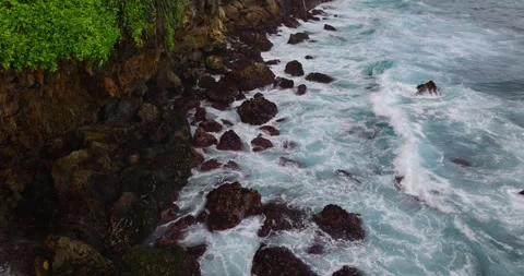 Waves and rocks, water flowing into the water Stock Footage 254636860