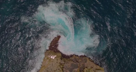 Waves and rocks, water flowing into the water Stock Footage 254636899