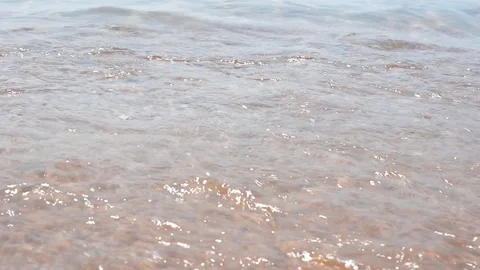 Waves and the sand on the beach close up Video stock 99833402