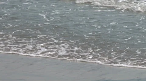 Waves and sand Stockbeeldmateriaal 30393859