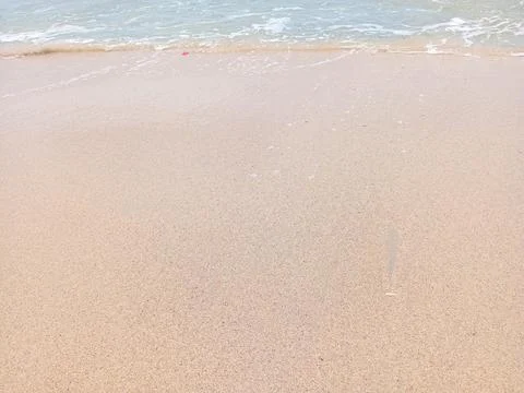 Waves and sand Stock Photos