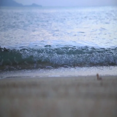 Waves and sand at sunrise Stock-Footage 69280202