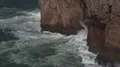 Waves and sea breeze close up at rocky coastline cliffs of Portugal 4k or 4k+ Resolution