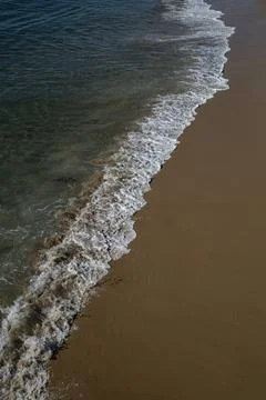 Waves and shoreline Stock Photos