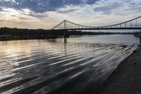 Waves and sky reflection under the bridge on Dnipro river, Kyiv city, Ukraine Stock Photos