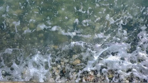 Waves and splashes on the pebble shore Video stock 144587019