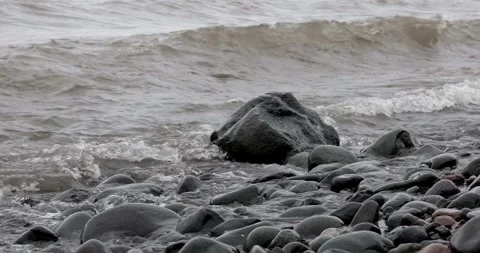 Waves and Splashes on rocks at shore of Lake Superior in Minnesota Stock Footage 283234485