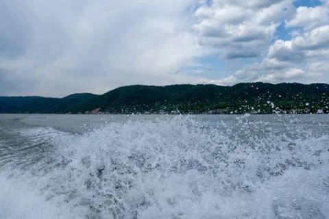 Waves and splashes of water behind the boat, danube, Romania, Danube boilers Stock Photos