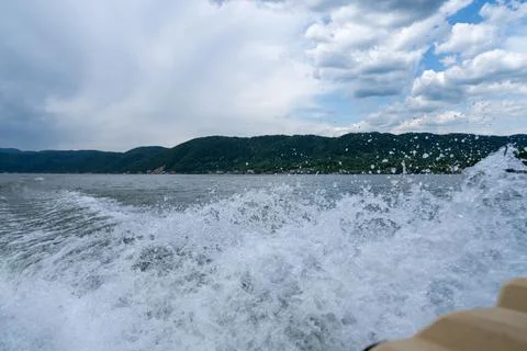 Waves and splashes of water behind the boat, danube, Romania, Danube boilers Stock Photos