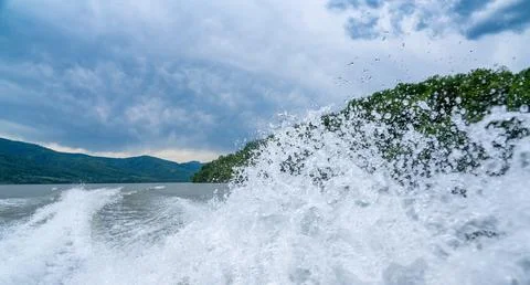 Waves and splashes of water behind the boat, danube, Romania, Danube boilers Stock Photos