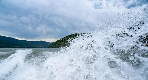 Waves and splashes of water behind the boat, danube, Romania, Danube boilers Stock Photos