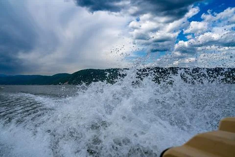 Waves and splashes of water behind the boat, danube, Romania, Danube boilers Stock Photos