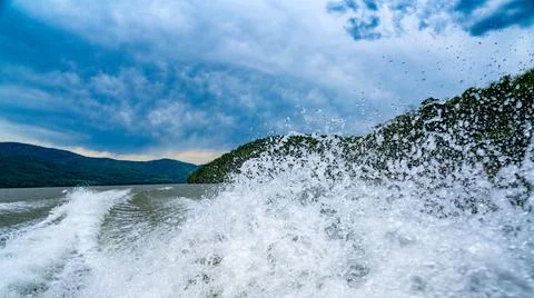 Waves and splashes of water behind the boat, danube, Romania, Danube boilers Stock Photos