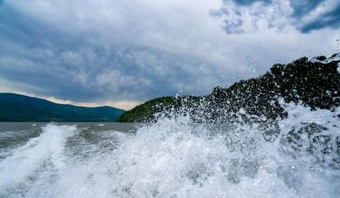 Waves and splashes of water behind the boat, danube, Romania, Danube boilers Stock Photos