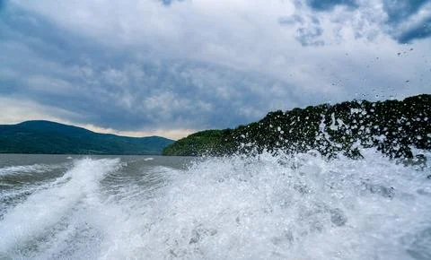Waves and splashes of water behind the boat, danube, Romania, Danube boilers Stock Photos