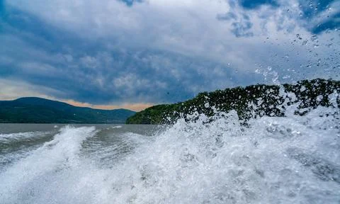 Waves and splashes of water behind the boat, danube, Romania, Danube boilers Stock Photos