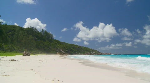 Waves and spume on sandy beach  Stock Footage 133220
