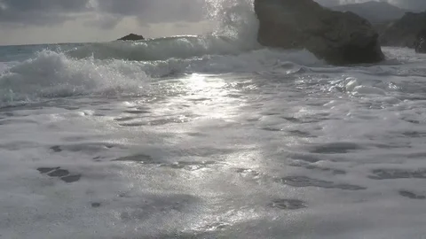 Waves and sun reflect in an Exotic Beach - Slow Motion Stock Footage 75927420
