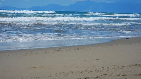 Waves and undertow of the rough sea stretch on the beach 4274 Stock Footage 107399253