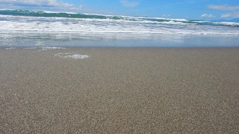 Waves and undertow of the rough sea stretch on the beach 4280 Stock Footage 107399324