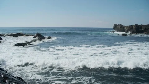 Waves and Volcanic Rocks Stock Footage 101838561