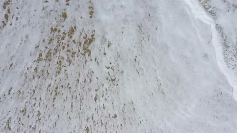 Waves and white foam on the sand Stock Footage 202605162