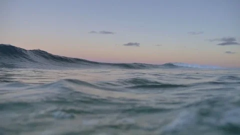 Waves Approaching Shore At Sunset Video stock 79733897