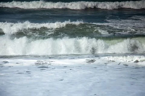The waves approaching the shoreline Stock Photos