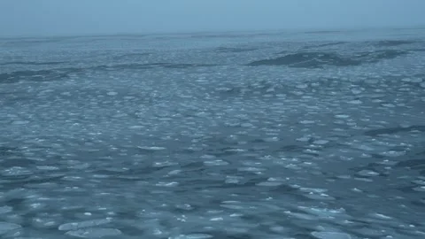 Waves in the Arctic Ocean. Pancake ice on the surface Stock Footage 266530340