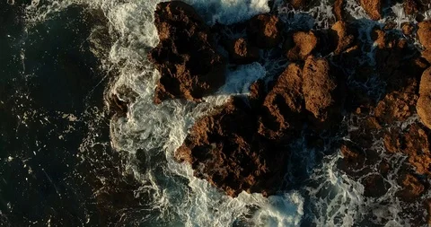 Waves are breaking on rocks sticking out of the water, stones. Stock Footage 97300446