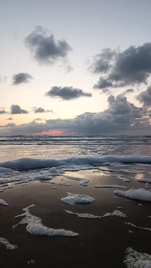 The waves are coming ashore. Sunset on the sea. Video stock 240730401